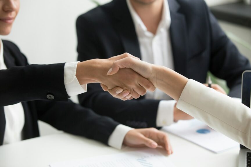 Business owner shaking hands with an IT support provider