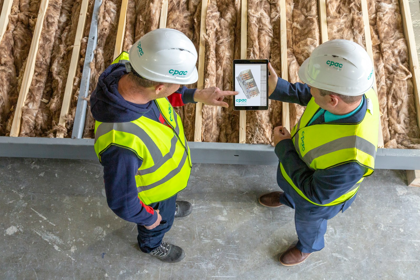Tradesperson using a tablet at work