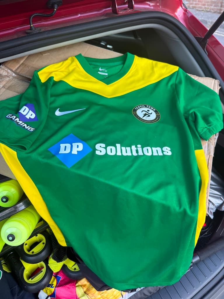 DP-Solutions logo on the front of a Yeovil Town Community Sports Trust football shirt